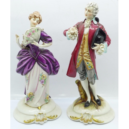 631 - A pair of Capodimonte figures and a German hand painted porcelain basket