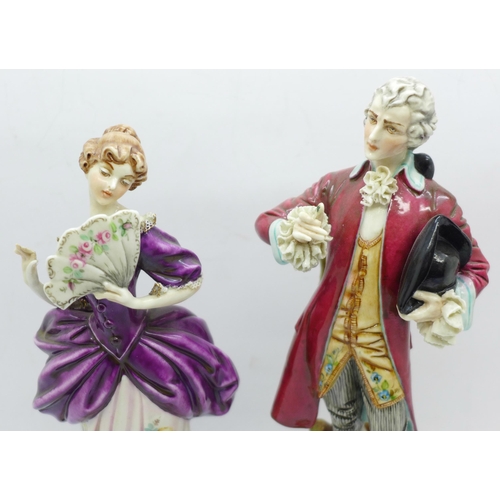 631 - A pair of Capodimonte figures and a German hand painted porcelain basket