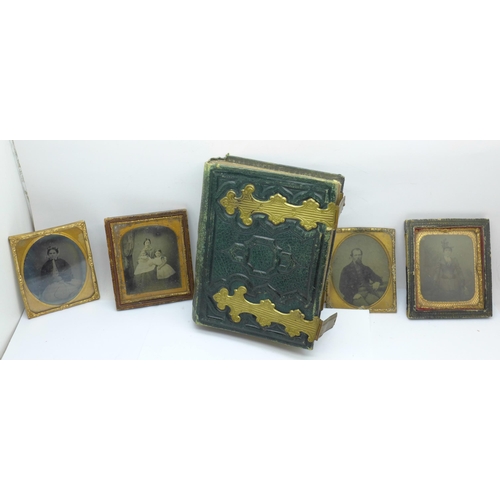 670 - Four Ambrotype photographs and an empty carte de visite album