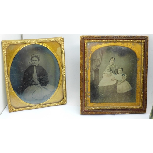 670 - Four Ambrotype photographs and an empty carte de visite album