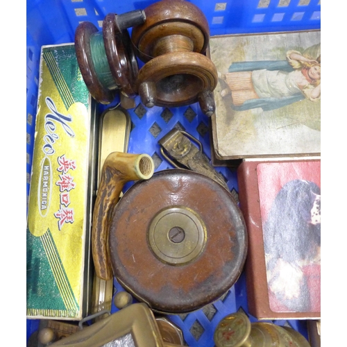 688 - Assorted items including fishing reels, cribbage board, 1970's 'trim' phone, harmonica, etc.