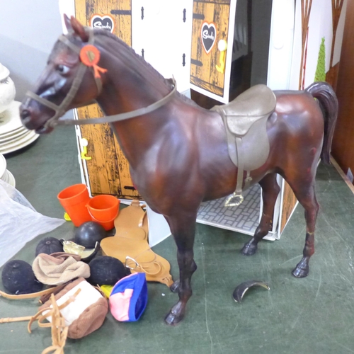 694 - A Sindy stable, two horses and accessories