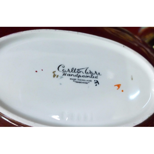 699 - A collection of Carlton Ware Rouge Royale including two dishes decorated with birds