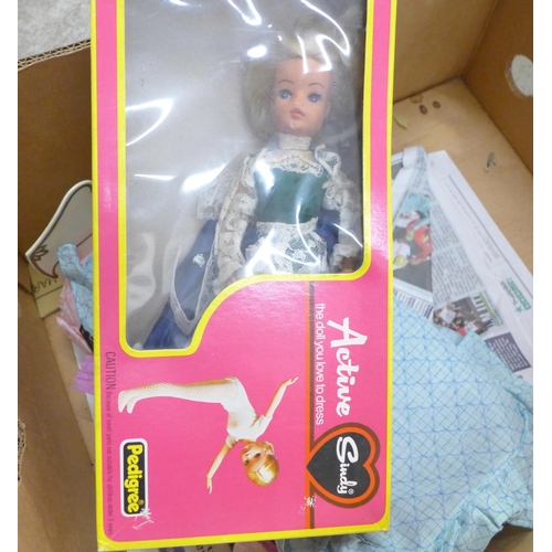 730 - A large collection of Sindy clothing, footwear, accessories, etc., and nine dolls