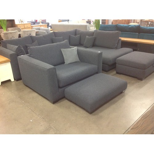 1302 - A grey upholstered designer corner sofa with footstool/ottoman,and a snuggler chair with footstool.