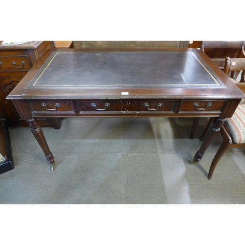 171 - A George IV style mahogany and leather topped six drawer library table