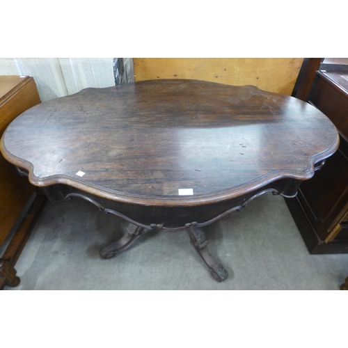 229 - A 19th Century French rosewood two drawer serpentine centre table