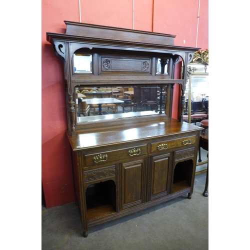 10 - An Arts and Crafts oak mirrorback sideboard