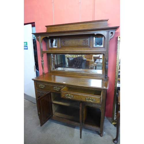 10 - An Arts and Crafts oak mirrorback sideboard