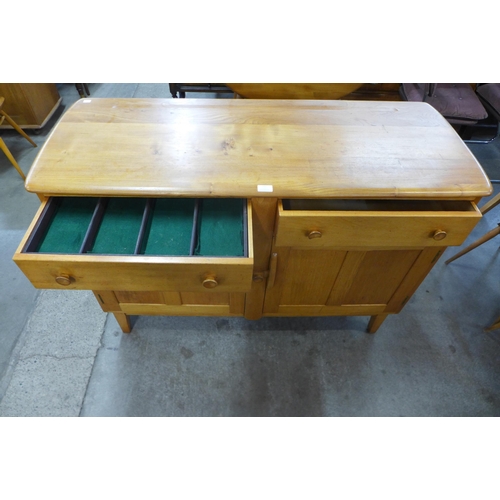 102 - An Ercol Blonde elm and beech sideboard