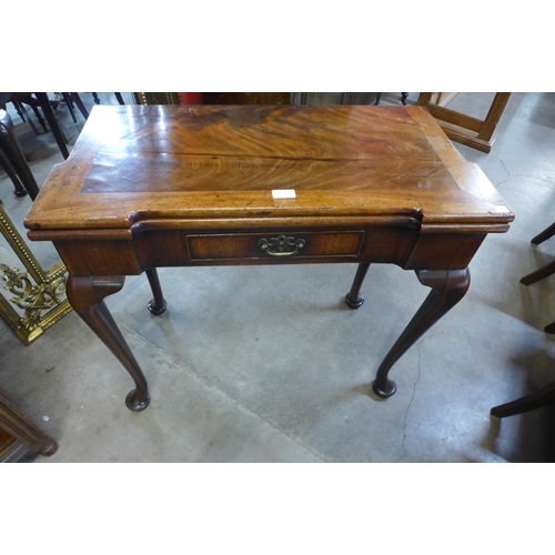 12 - A George II mahogany rectangular fold over tea table