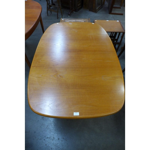 121 - A Danish teak extending dining table