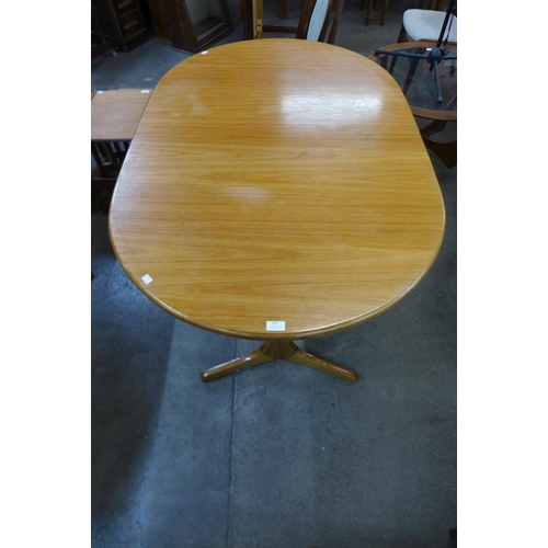 123 - A Sutcliffe of Todmorden teak extending dining table