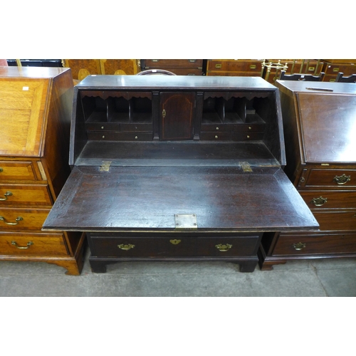 141 - A George III oak bureau