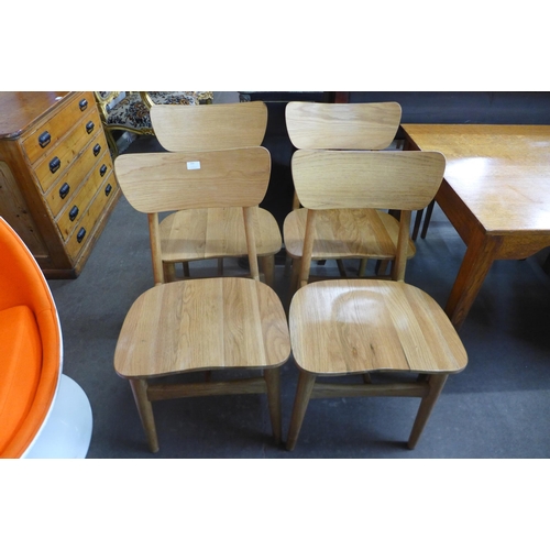 155 - A set of four oak and ash chairs