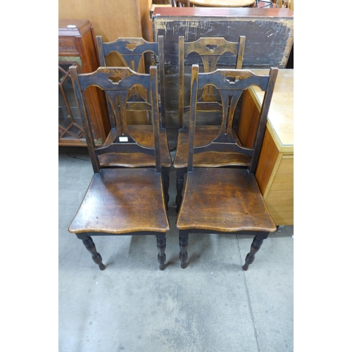 162 - A set of four Arts and Crafts mahogany and beech chairs