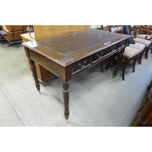 171 - A George IV style mahogany and leather topped six drawer library table