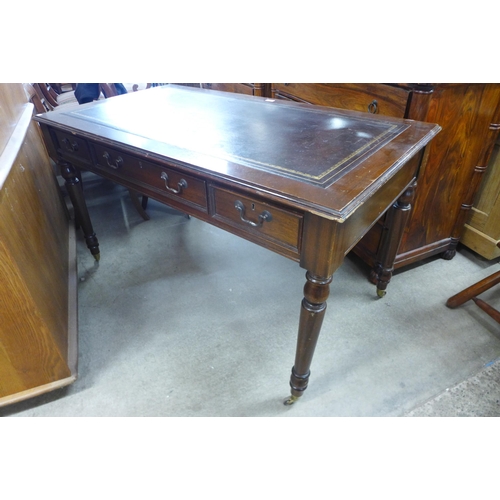 171 - A George IV style mahogany and leather topped six drawer library table