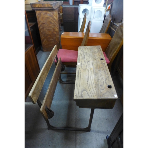 216 - A child's steel and elm double school desk