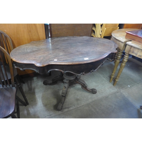 229 - A 19th Century French rosewood two drawer serpentine centre table