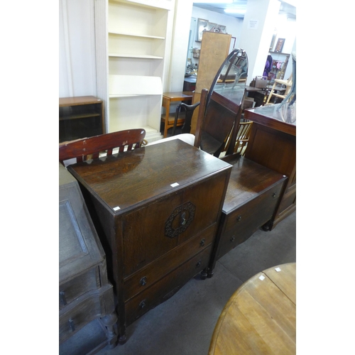 239 - An oak two tallboy and dressing table