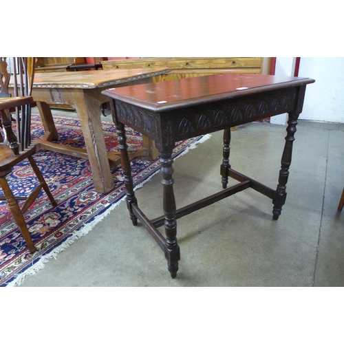 27 - An early 20th Century Edwards & Roberts carved oak occasional table