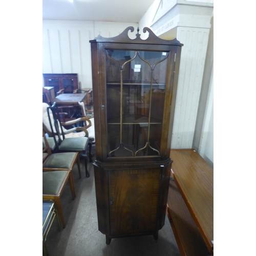 279 - A mahogany freestanding corner cabinet