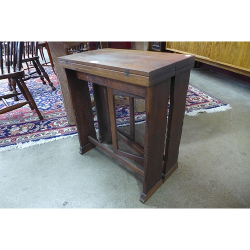 28 - A Cotswold School walnut folding coffee table