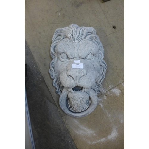 298 - A concrete lion wall mask and a concrete bust of a goblin, an English Bull Terrier concrete plaque a... 