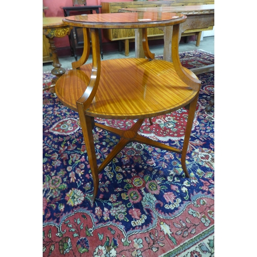 32 - An Edward VII inlaid satinwood circular two tier etagere