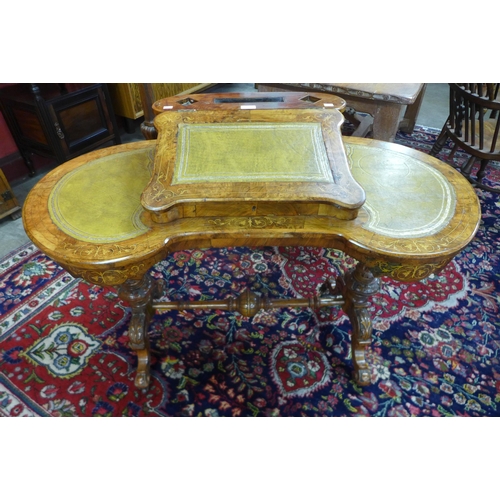 33 - A Victorian inlaid walnut and green leather Davenport top kidney shaped writing table