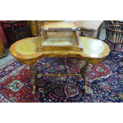 33 - A Victorian inlaid walnut and green leather Davenport top kidney shaped writing table