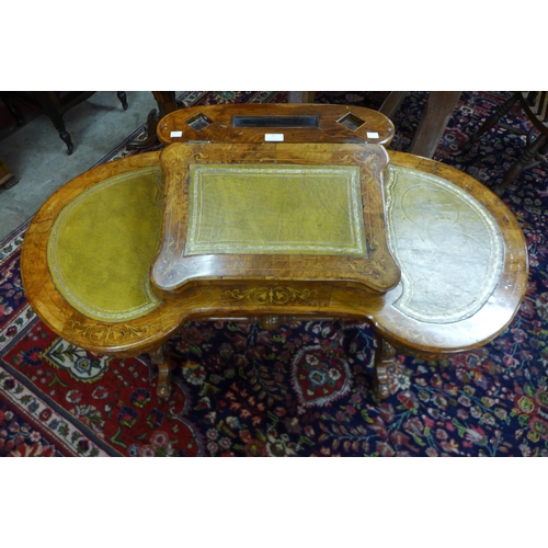 33 - A Victorian inlaid walnut and green leather Davenport top kidney shaped writing table