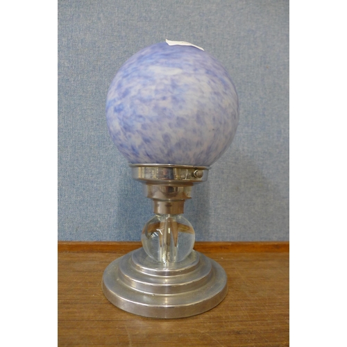 356 - A blue glass globular table lamp on chrome base