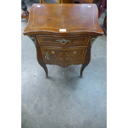 36 - A French Louis XV style inlaid mahogany and gilt metal mounted bombe shaped petit commode