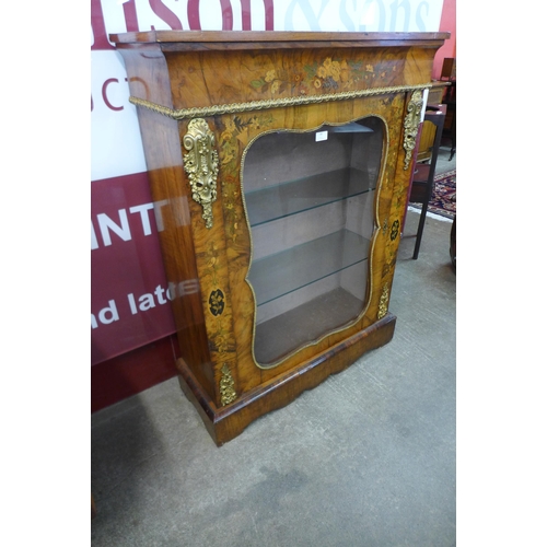 39 - A Victorian walnut and marquetry inlaid pier cabinet