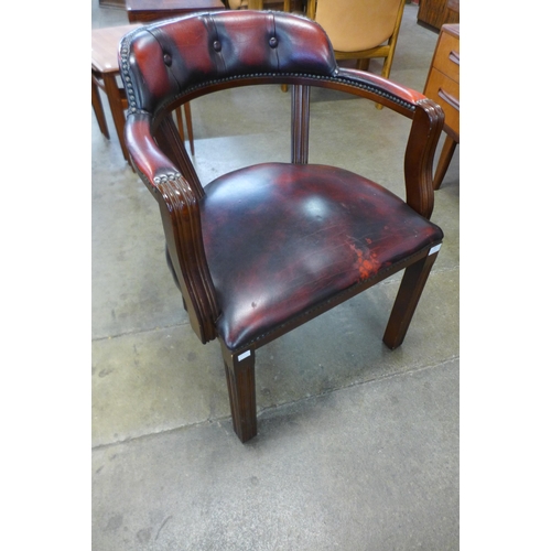 44 - A mahogany and red leather desk chair