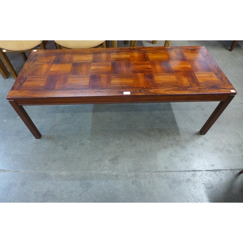 62 - A Norwegian Heggen Nordfjordeid rosewood coffee table, 46cms h, 140cms l, 56cms w

*Accompanied with... 