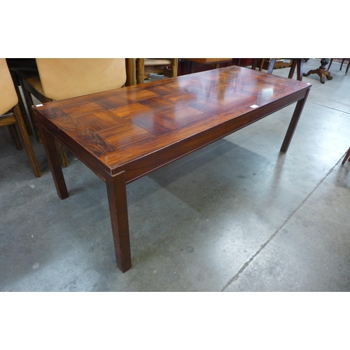 62 - A Norwegian Heggen Nordfjordeid rosewood coffee table, 46cms h, 140cms l, 56cms w

*Accompanied with... 