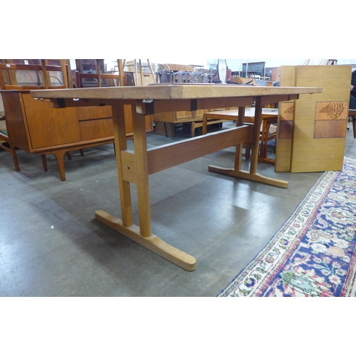 88 - A Danish oak and tiled top extending dining table