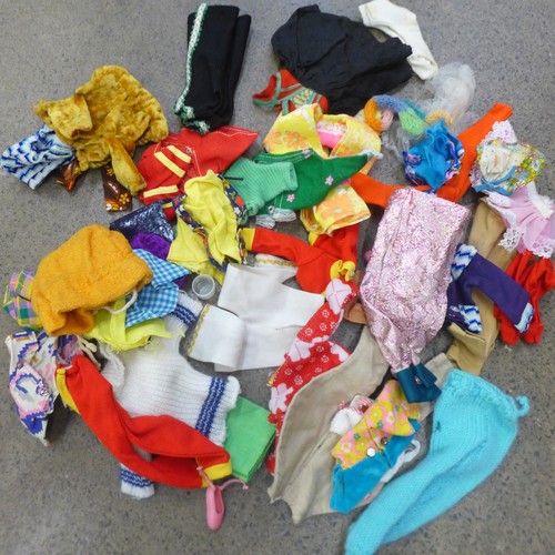 730 - A large collection of Sindy clothing, footwear, accessories, etc., and nine dolls