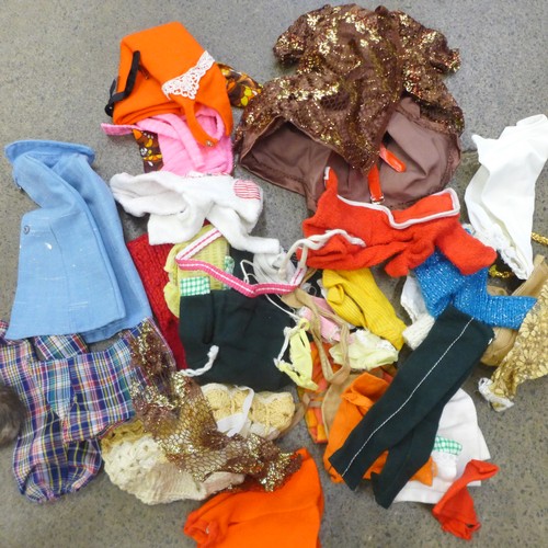 730 - A large collection of Sindy clothing, footwear, accessories, etc., and nine dolls