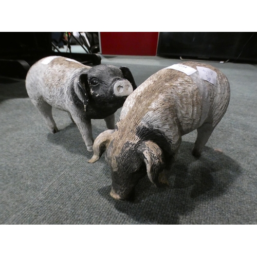 3034 - A pair of fibreglass pigs (approx. 7