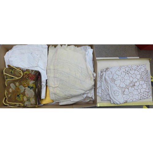 1299 - A box of Victorian and later table linen, children's clothing, a woolwork table or mantelpiece runne... 