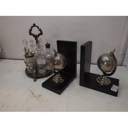 2115 - Pair of globe book ends and silver plate cruet set in table server