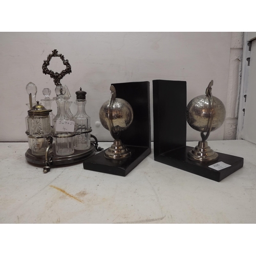 2115 - Pair of globe book ends and silver plate cruet set in table server