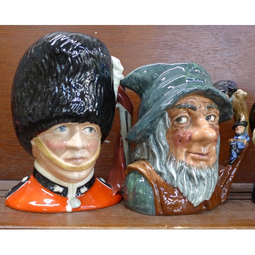 602 - Four large Royal Doulton character jugs, The Guardsman, Rip Van Winkle, Mad Hatter and Gone Away