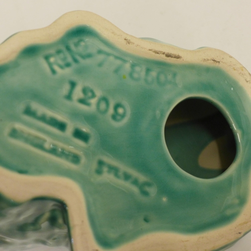 606 - A large green Sylvac dog, 778504 1209 back stamp, 28cm