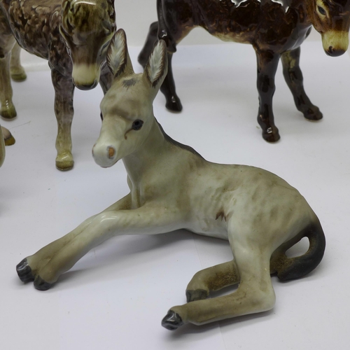 705 - Eight models of donkeys, Goebel x2, Beswick, Kaiser, etc., a/f