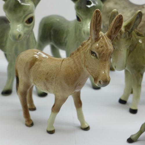 705 - Eight models of donkeys, Goebel x2, Beswick, Kaiser, etc., a/f